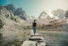 Adventure Travel Across a Footbridge in the Mountains. Image Courtesy: Lorenzo Castellino, Pexels