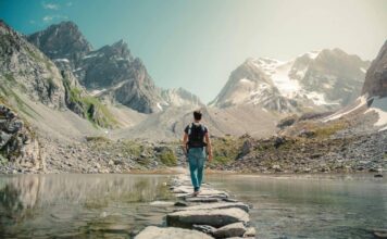 Adventure Travel Across a Footbridge in the Mountains. Image Courtesy: Lorenzo Castellino, Pexels